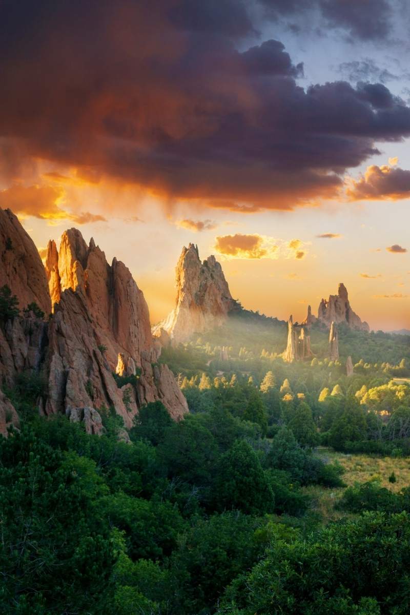 Sunset over Garden of the Gods with city lights