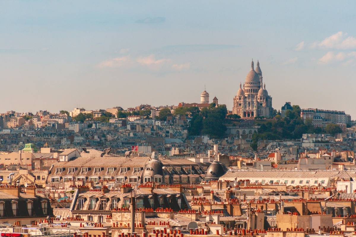 Paris rooftops and Sacré-Cœur at dusk